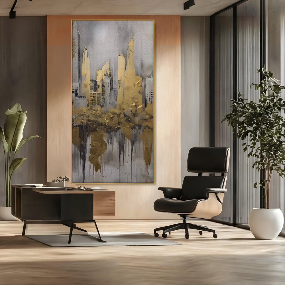 Tablou canvas cu tablou canvas cu zgarie-nori aurii, in rama de aluminiu auriu, pe perete intr-un birou